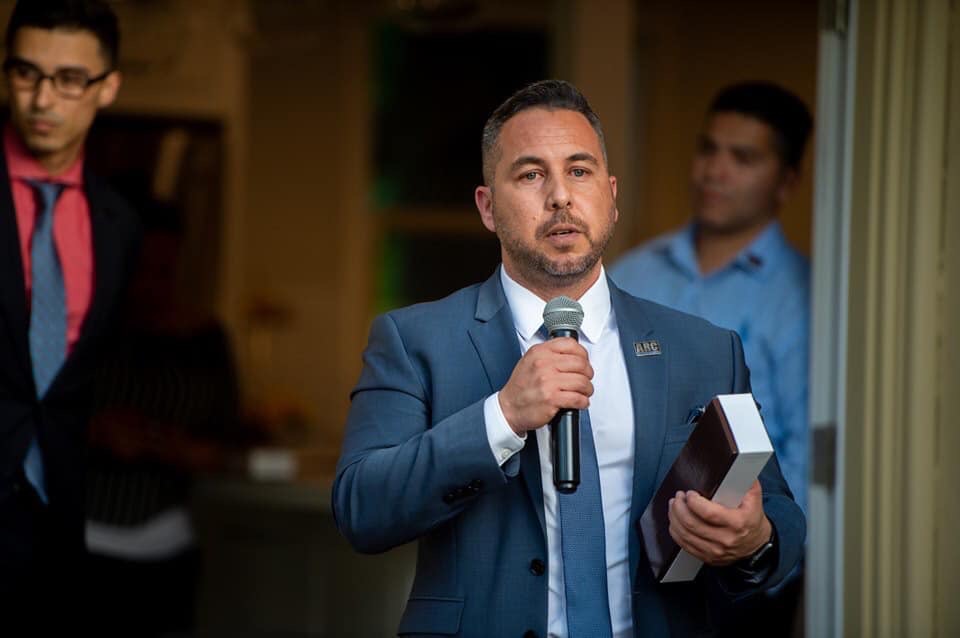 Michael Mendoza speaking at a public event