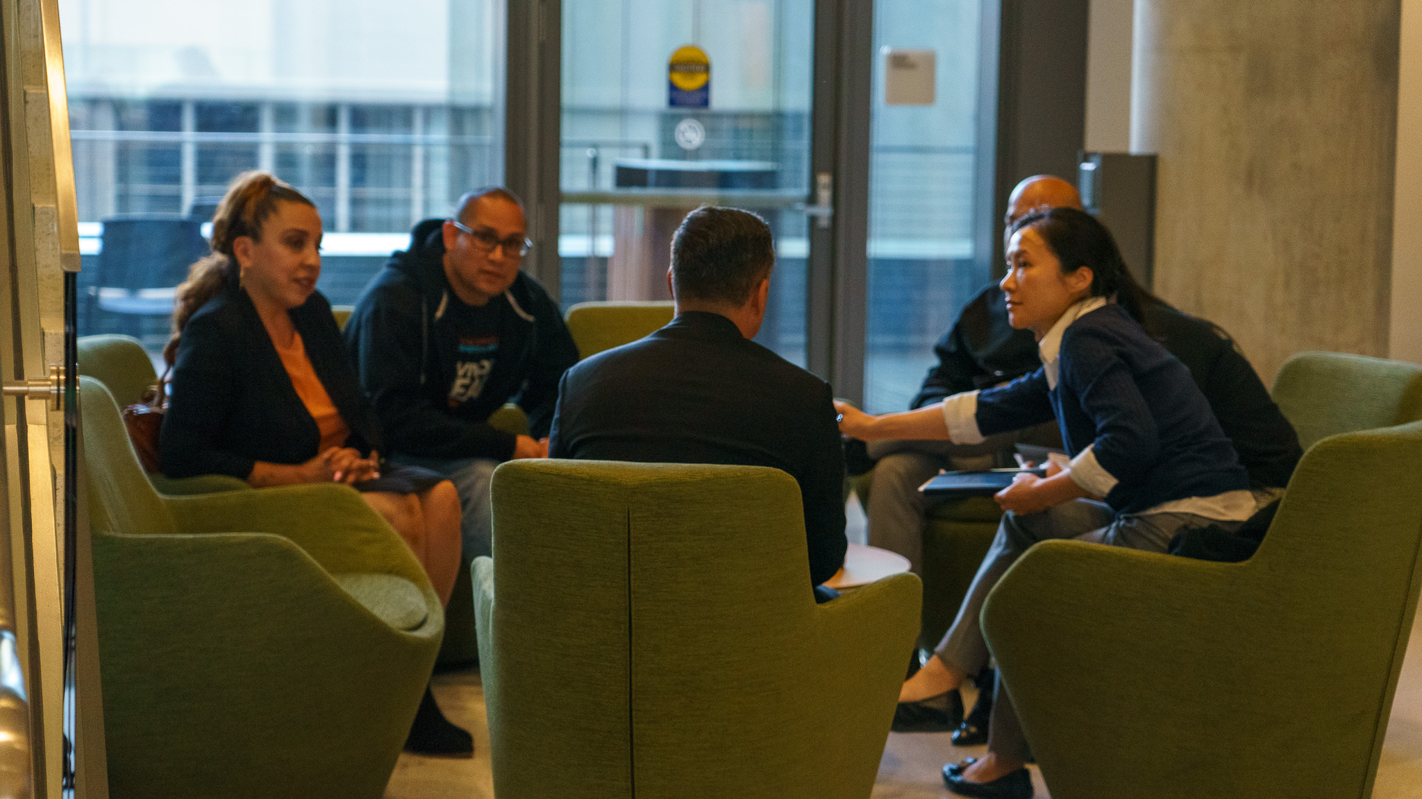 Michael Mendoza in a stakeholder strategy meeting with colleagues